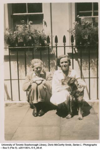 Ted and Elizabeth Acheson with dog in London, England
