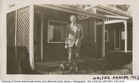 Walter Fraser on porch with dog