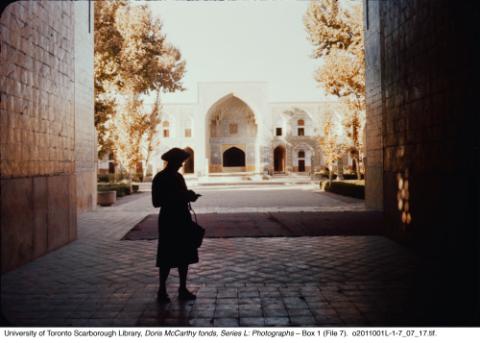 Figure in entrance to courtyard of a mosque