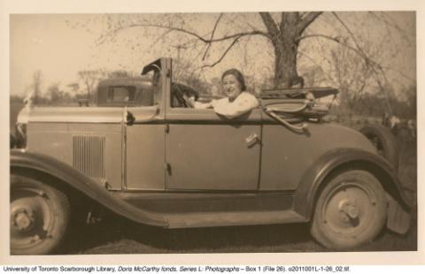 Doris McCarthy in a convertible car