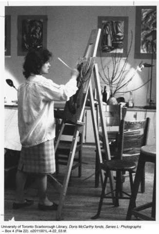 Woman painting a still life
