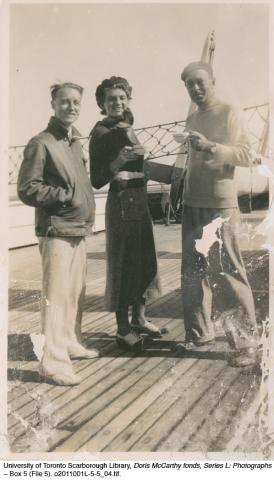 Marjorie with two men on the deck