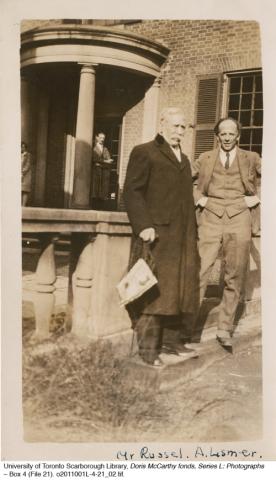 Two men standing in front of building