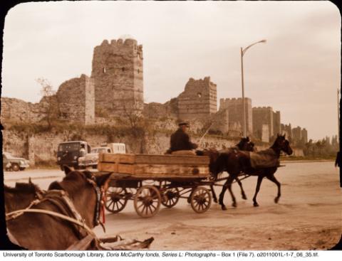 Ancient fortifications with horse-drawn cart