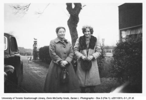 Doris McCarthy and Virginia (Ginny) Luz in front of tree